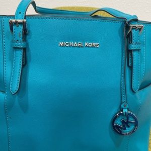 Michael Kors aqua color, silver details  lots of puckets